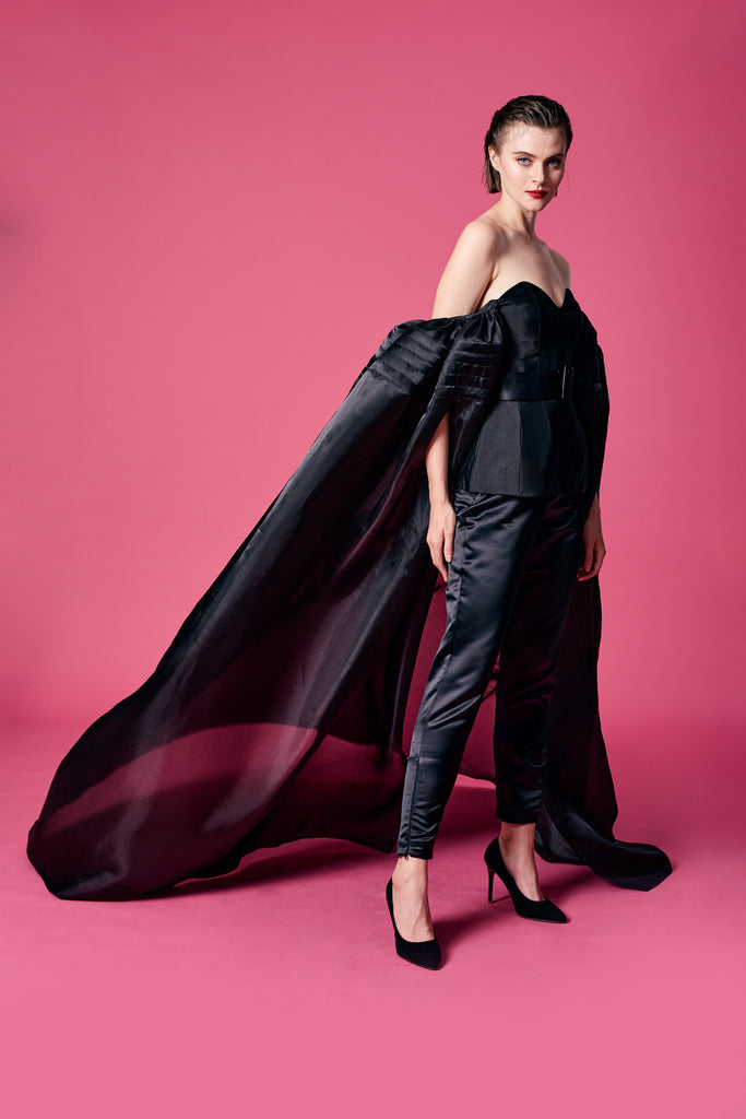 15.	Black ruffle cape-effect bustier with Black trouser