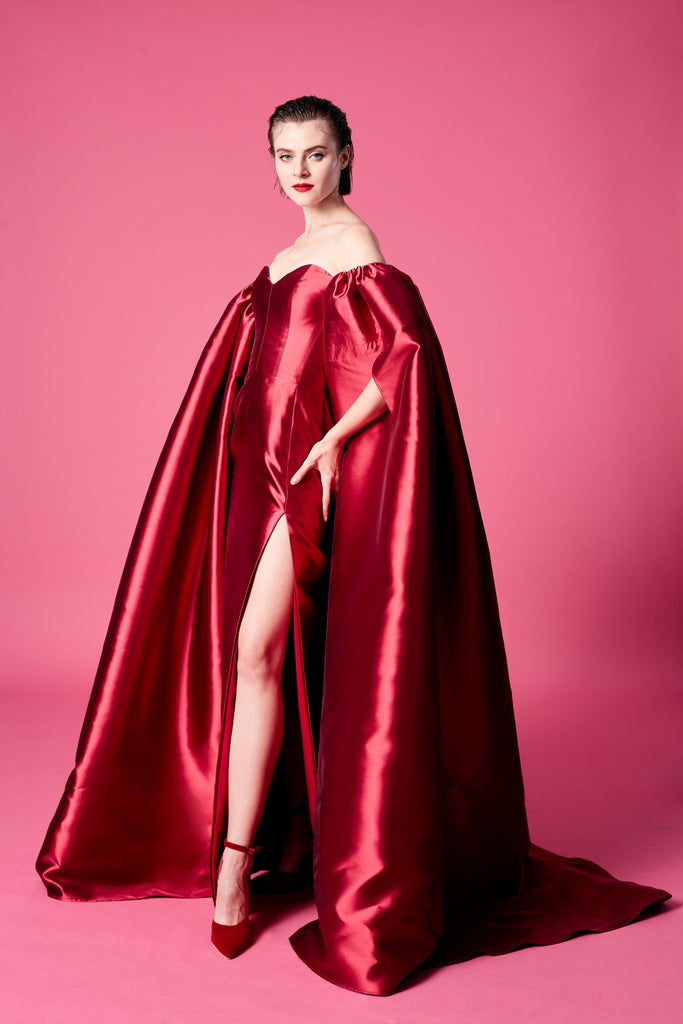22.	Red cape-effect dress